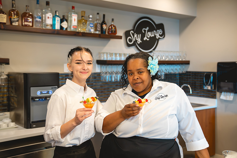 two female chefs posing for camera in the sky lounge