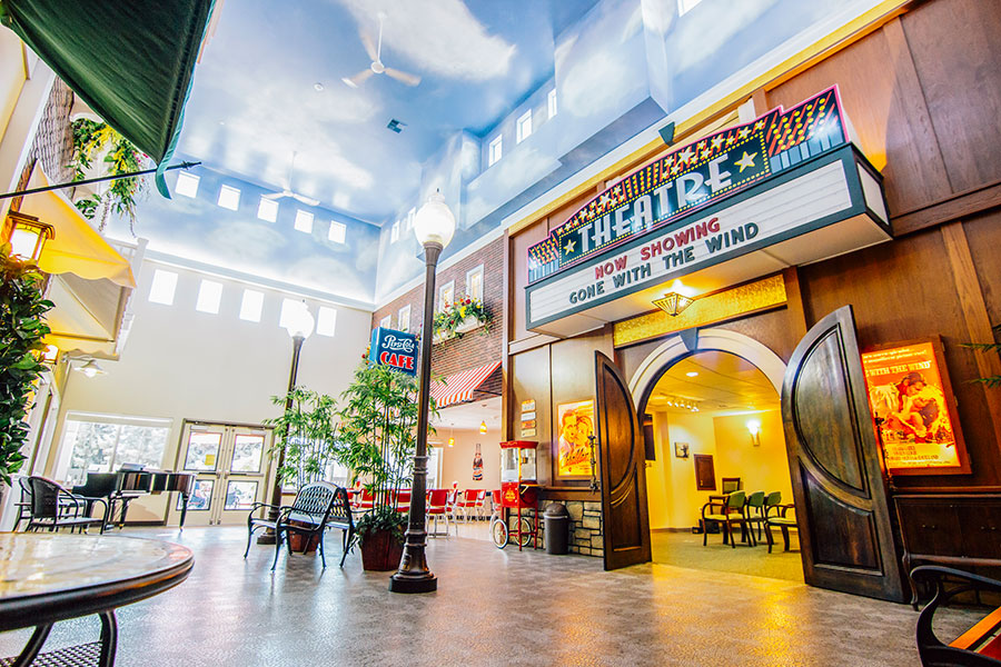 Lively indoor theater with café, showing